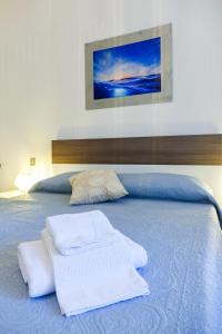 Postel nebo postele na pokoji v ubytování Don Alfonso Apartaments