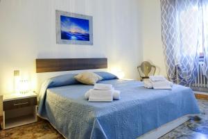 Postel nebo postele na pokoji v ubytování Don Alfonso Apartaments