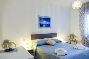 Postel nebo postele na pokoji v ubytování Don Alfonso Apartaments