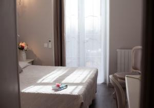 Un ou plusieurs lits dans un hébergement de l'établissement Hôtel restaurant Oasis