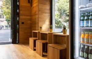 a room with a refrigerator filled with lots of drinks at Chapter Roma in Rome