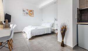Orizontes Boutique Studios客房内的一张或多张床位