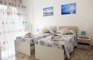 Postel nebo postele na pokoji v ubytování Don Alfonso Apartaments