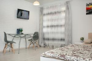 Μια τηλεόραση ή/και κέντρο ψυχαγωγίας στο апартаменты возле Лавины.Новый дом. 1 этаж