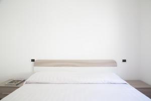 Posteľ alebo postele v izbe v ubytovaní Airone Residence