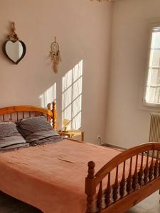 Ένα ή περισσότερα κρεβάτια σε δωμάτιο στο Chez maman