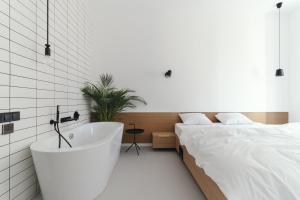 Posteľ alebo postele v izbe v ubytovaní Owntown Apart Hotel