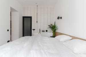 Posteľ alebo postele v izbe v ubytovaní Owntown Apart Hotel