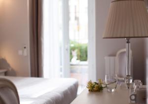 Un ou plusieurs lits dans un hébergement de l'établissement Hôtel restaurant Oasis
