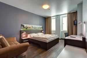 Postel nebo postele na pokoji v ubytování MEININGER Hotel Wien Downtown Sissi