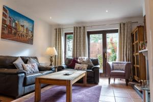 a living room with couches and a coffee table at Liberty Townhouses in Dublin