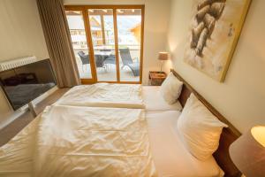 Katil atau katil-katil dalam bilik di Apart Holidays - Marina Walensee