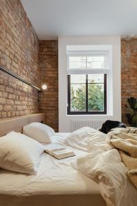 Posteľ alebo postele v izbe v ubytovaní Owntown Apart Hotel