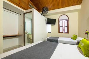Cama o camas de una habitación en Ayenda 1411 Caney Sede Ingenio