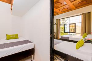 Cama o camas de una habitación en Ayenda 1411 Caney Sede Ingenio