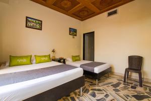 Cama o camas de una habitación en Ayenda 1411 Caney Sede Ingenio