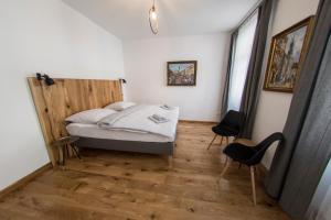 Postel nebo postele na pokoji v ubytování Penzion Šťastný medvěd