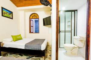 Cama o camas de una habitación en Ayenda 1411 Caney Sede Ingenio