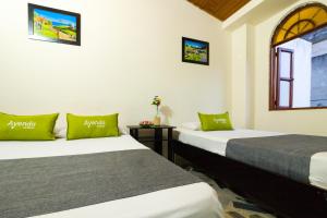 Cama o camas de una habitación en Ayenda 1411 Caney Sede Ingenio