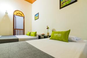 Cama o camas de una habitación en Ayenda 1411 Caney Sede Ingenio