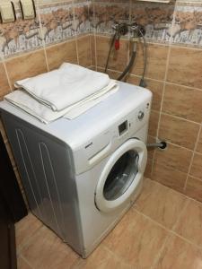 a washing machine with towels on top of it at Konak Apart Hotel in Istanbul