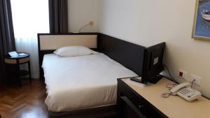 Torrione Hotel客房内的一张或多张床位