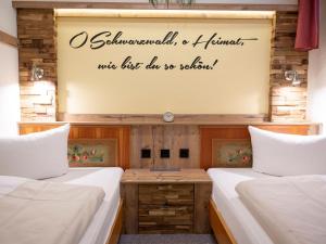 Postel nebo postele na pokoji v ubytování Appartmentvermietung Terrassenpark Schonach