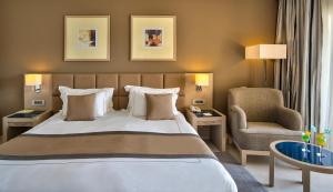 Cleopatra Luxury Resort Makadi Bay tesisinde bir odada yatak veya yataklar