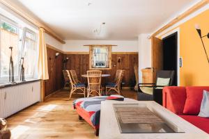 a living room with a couch and a table at Casa Piedro in Starnberg