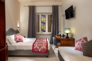 Posteľ alebo postele v izbe v ubytovaní Prima Guest House Collection