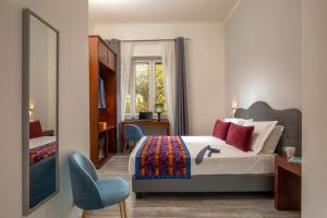 Posteľ alebo postele v izbe v ubytovaní Prima Guest House Collection