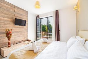 Ένα ή περισσότερα κρεβάτια σε δωμάτιο στο Art Gallery Apartment in Silver Mountain +36 φωτογραφίες