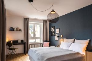 Voodi või voodid majutusasutuse Genusshotel Krone & Roadtrips bei Basel toas