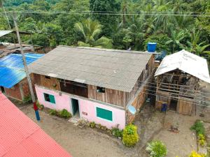 an overhead view of a house with a roof at Posada La Sirena Negra in Nuquí