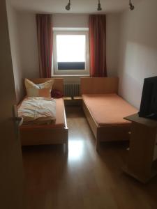 Postel nebo postele na pokoji v ubytování Ferienwohnung Asum