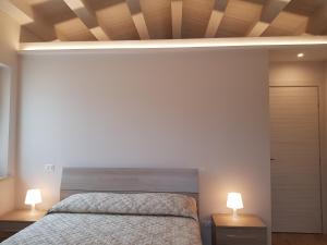 Łóżko lub łóżka w pokoju w obiekcie Agriturismo Villa al piano