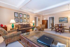 a living room with a couch and a table at Lombardy Hotel in New York