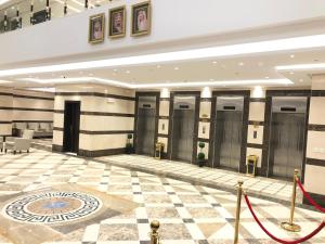 a lobby of a building with a checkered floor at Zaha Al Madina Hotel in Medina