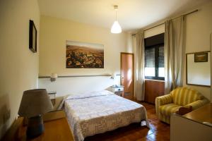 Postel nebo postele na pokoji v ubytování Hotel Ai Tufi