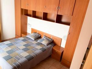 מיטה או מיטות בחדר ב-Apartamentos Canillo Ribagrossa 3000