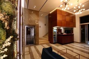 TV a/nebo společenská místnost v ubytování Aurelis Hotel