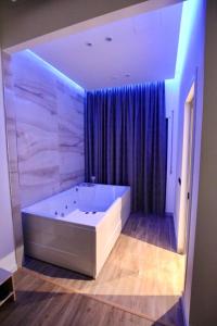 Postel nebo postele na pokoji v ubytování Aurelis Hotel
