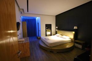 Postel nebo postele na pokoji v ubytování Aurelis Hotel