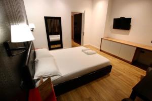Postel nebo postele na pokoji v ubytování Aurelis Hotel
