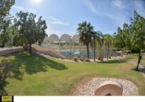a resort with a slide and a swimming pool at Royal Suite Caesarea in Caesarea