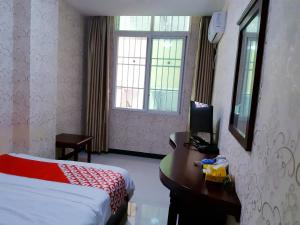 XiShuangBanNa International Aerial Garden South of Mekong River Business Hotel 傣江南商务酒店客房内的一张或多张床位