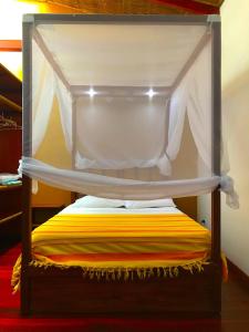 a wooden shelf with a cover on top of it at Villa 3 - High End Studio Apartment with kitchen, Playa Chiquita in Cocles