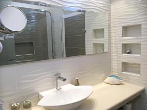 Ванная комната в Haris Hotel Apartments and Suites