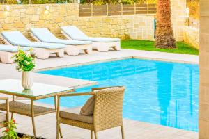 The swimming pool at or close to Villa Elenitsa