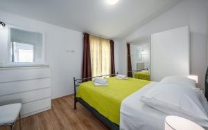 Postel nebo postele na pokoji v ubytování Apartment Kraljevic